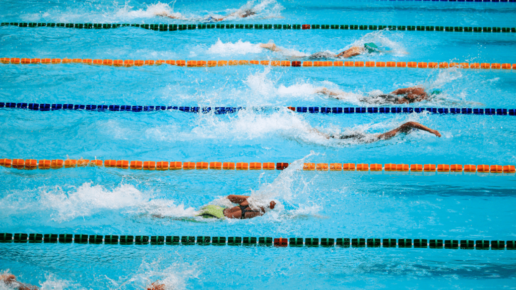 group of swimmers racing