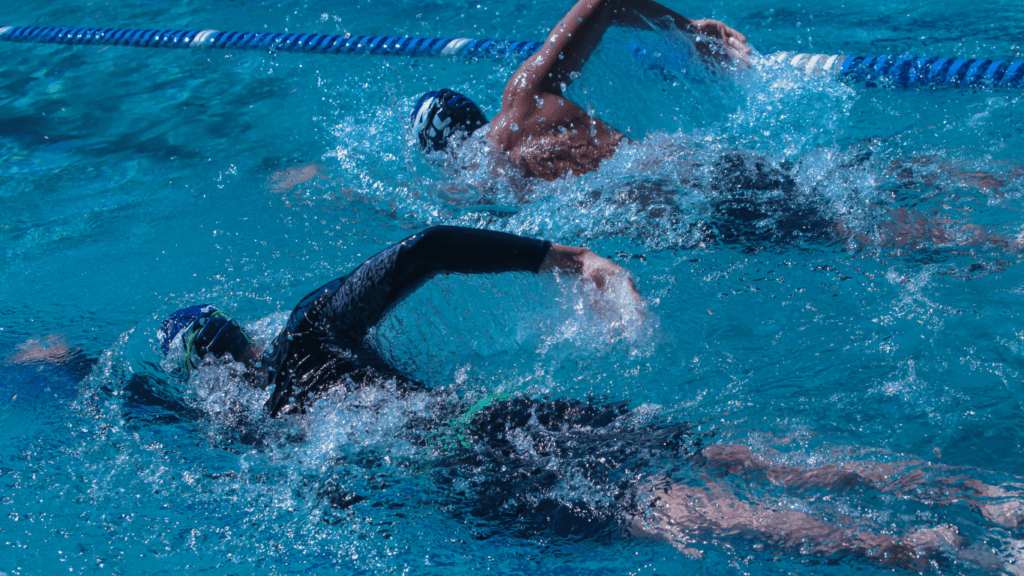 two swimmers competing