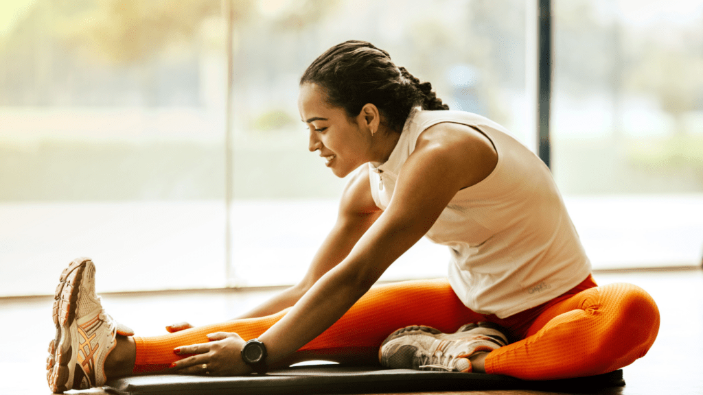 a woman doing a cool down stretching