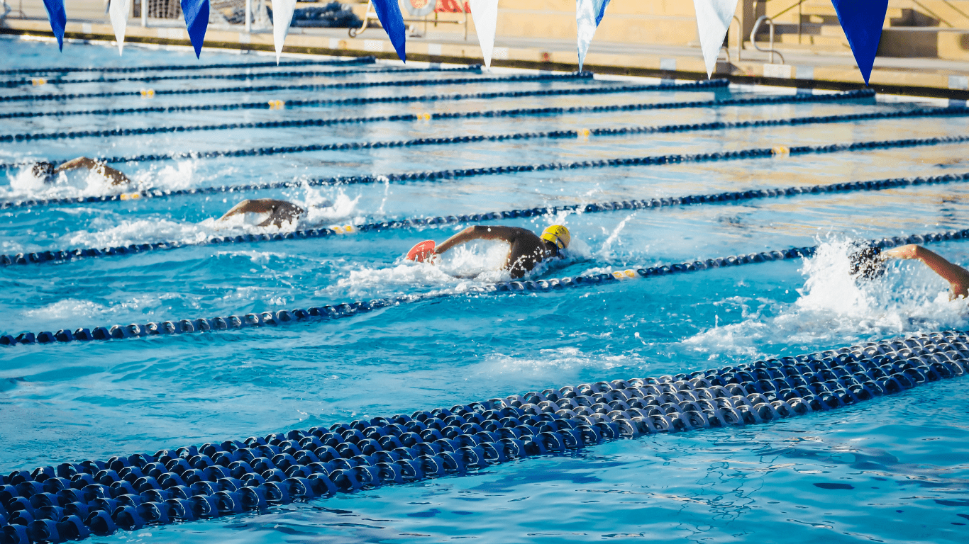 group of swimmers conquering a swimming competition