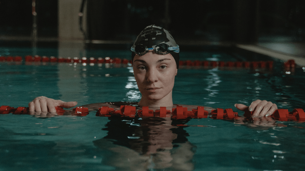 a woman in a swimming pool wearing a perfect fit