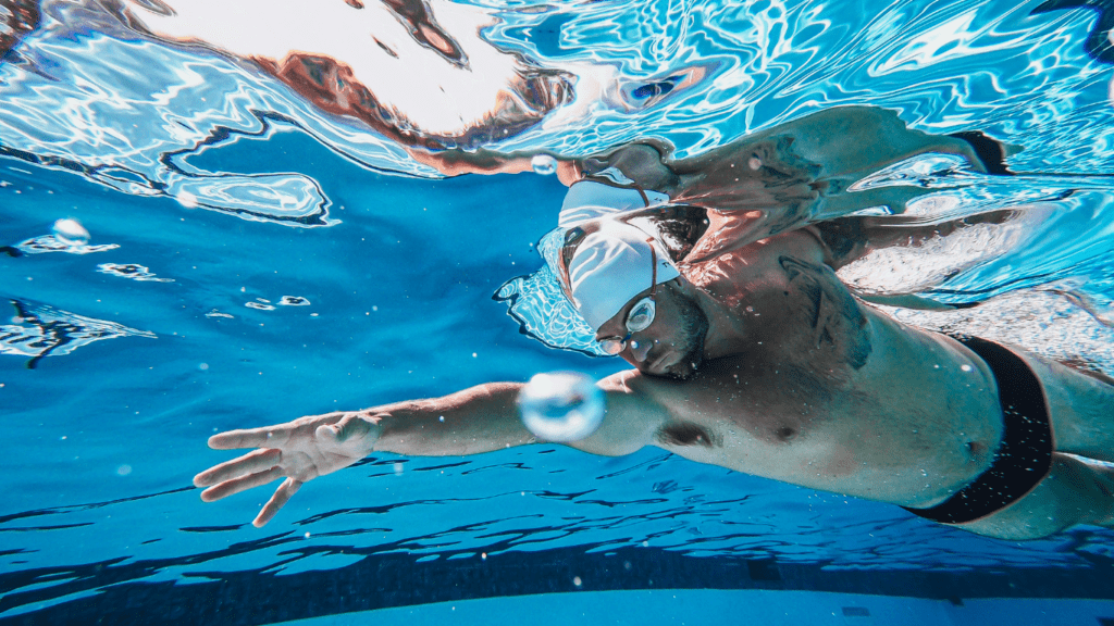 a man having a swimming performance