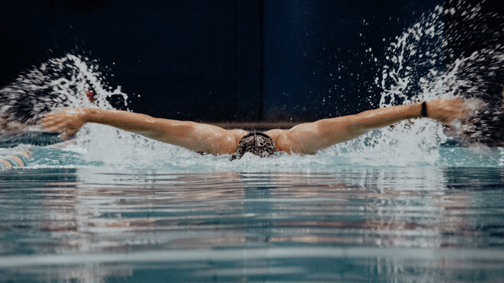 a man doing a perfect swimming stroke