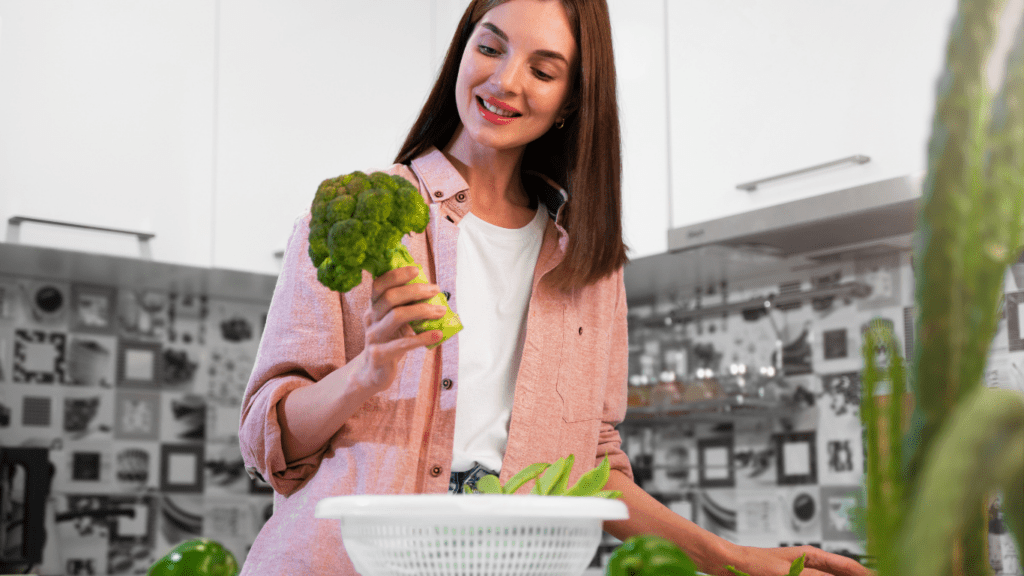 a woman holding a vegetable